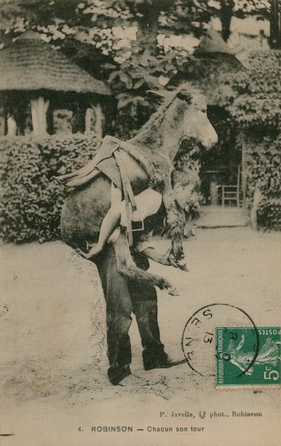 Postcard of a man carrying a donkey, sent in 1913 by French Photographer